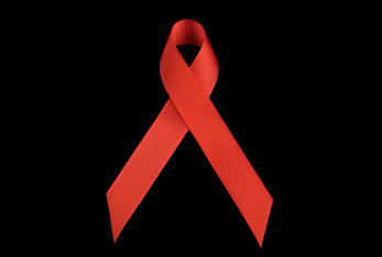 Le Ruban rouge, symbole de la solidarité avec les personnes séro-positives.